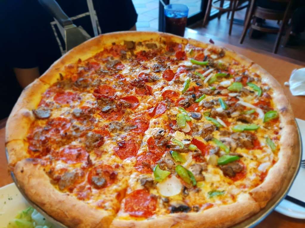 NYPD Pizza at Lake Cay | 8716, 9900 Universal Blvd #100, Orlando, FL 32819, USA | Phone: (407) 992-8990