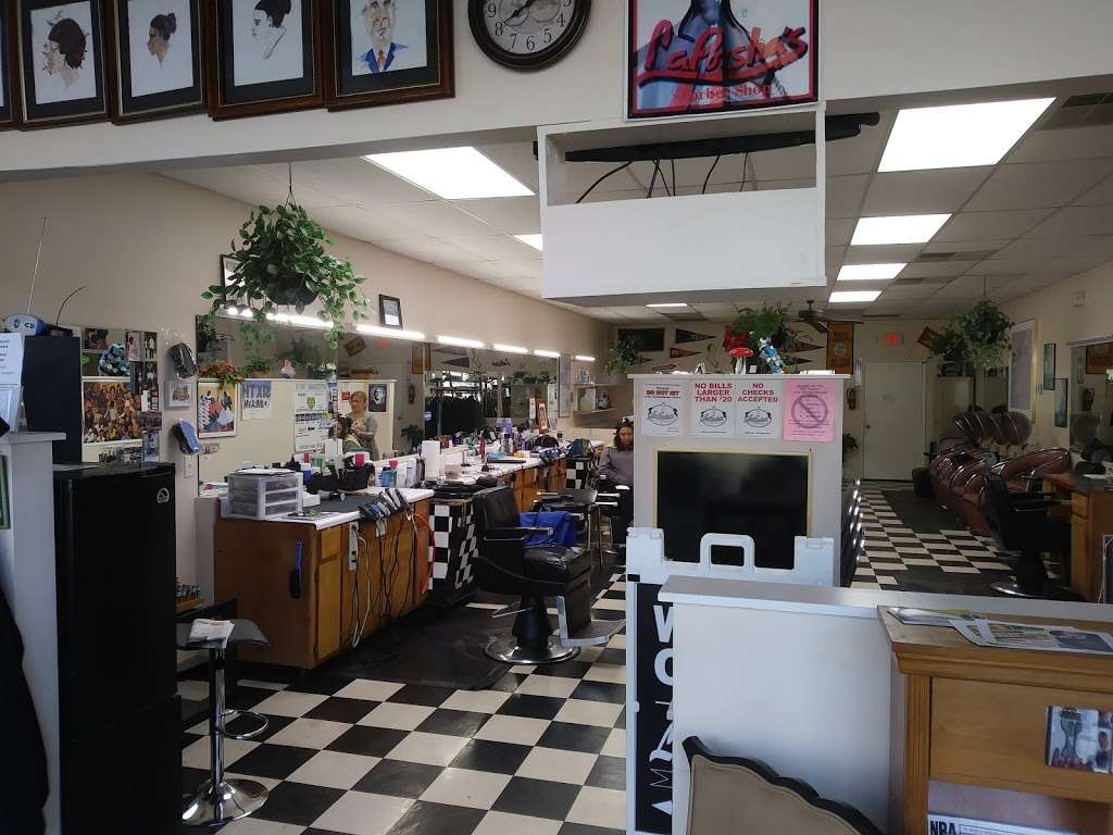 Laporshas Barbershop (circa 1994) | 8829 E W.T. Harris Blvd, Charlotte, NC 28227, USA | Phone: (704) 568-3400