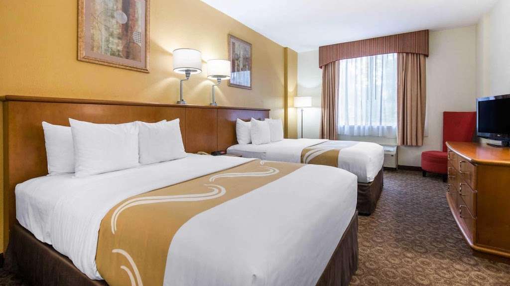 Quality Inn & Suites Near the Theme Parks | 5635 Windhover Dr, Orlando, FL 32819, USA | Phone: (407) 370-5100